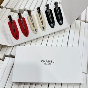 CHANEL Red, Cream, and Black Hair Clip Trio